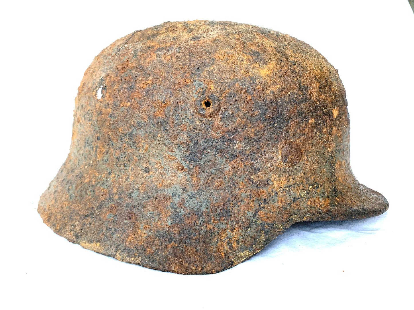 WW2 German M40 Battle Damaged Helmet recovered from the Eastern Front.