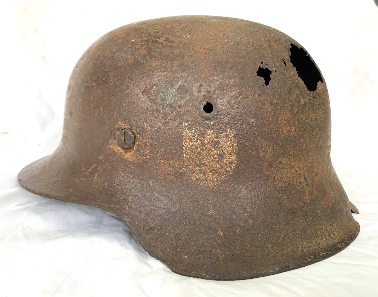WW2 German M42 single decal Battle Damaged Helmet with Liner recovered from the Eastern Front