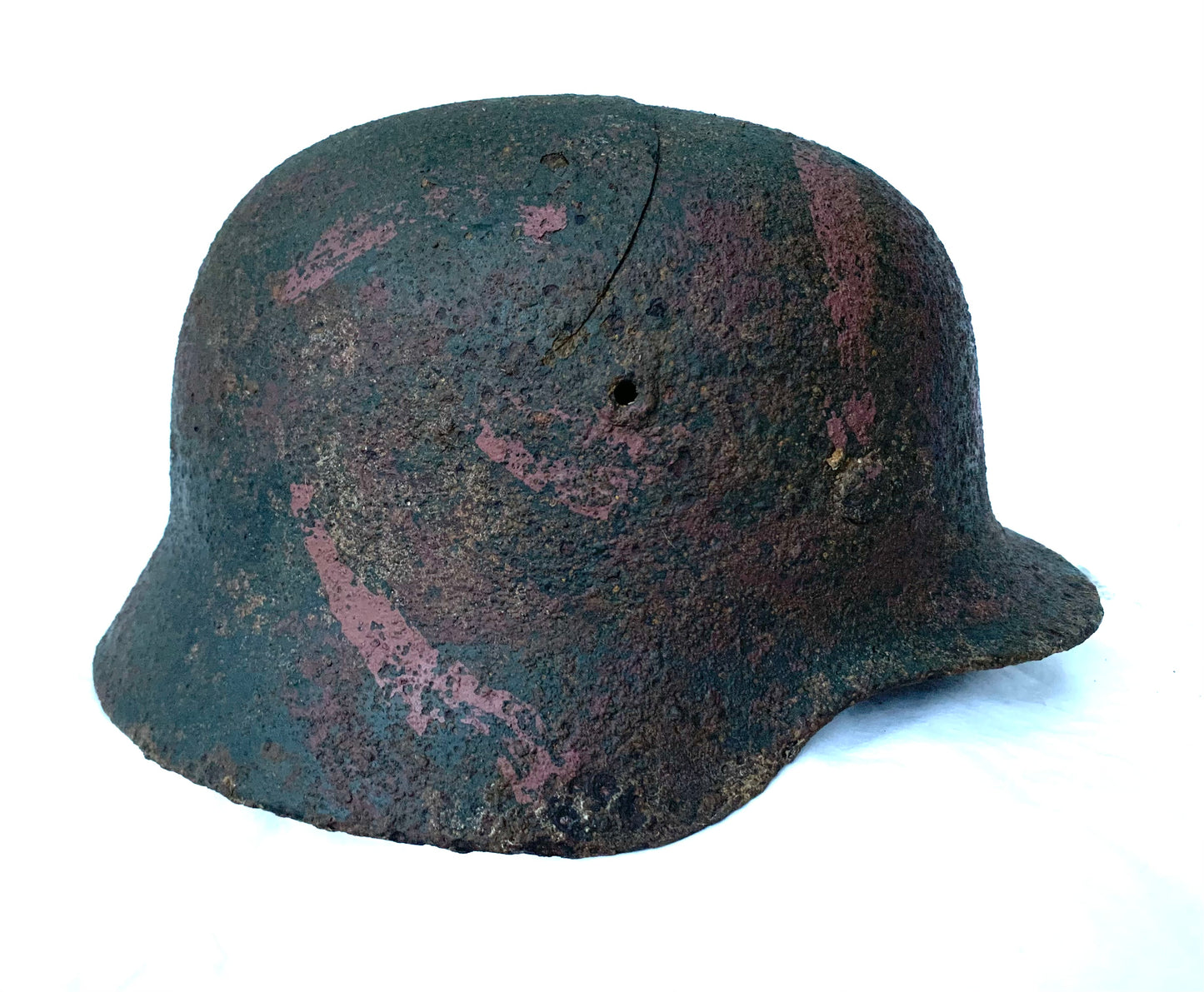WW2 German M40 Single Decal Battle Damaged Camo Helmet recovered from the Eastern Front