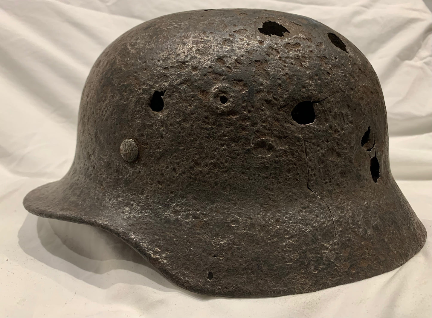 WW2 German M40 Battle Damaged Helmet from the Eastern Front.