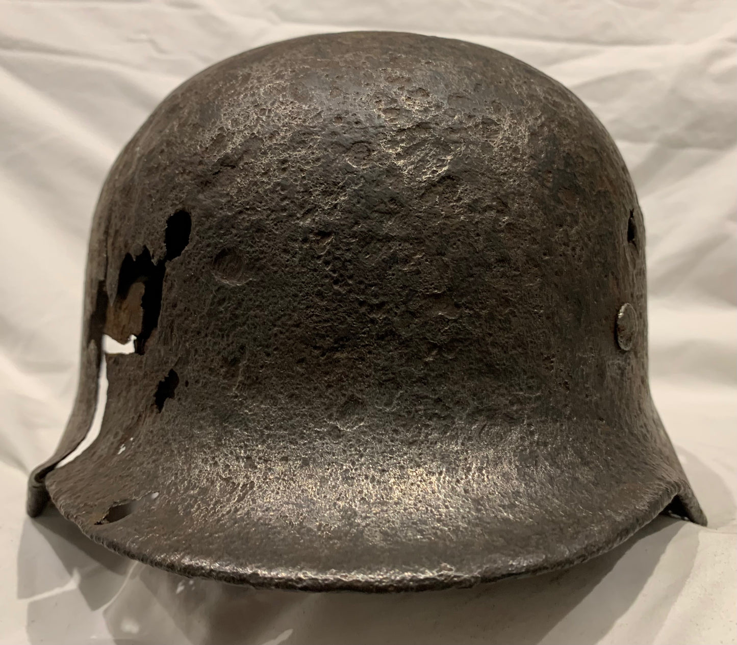 WW2 German M40 Battle Damaged Helmet from the Eastern Front.